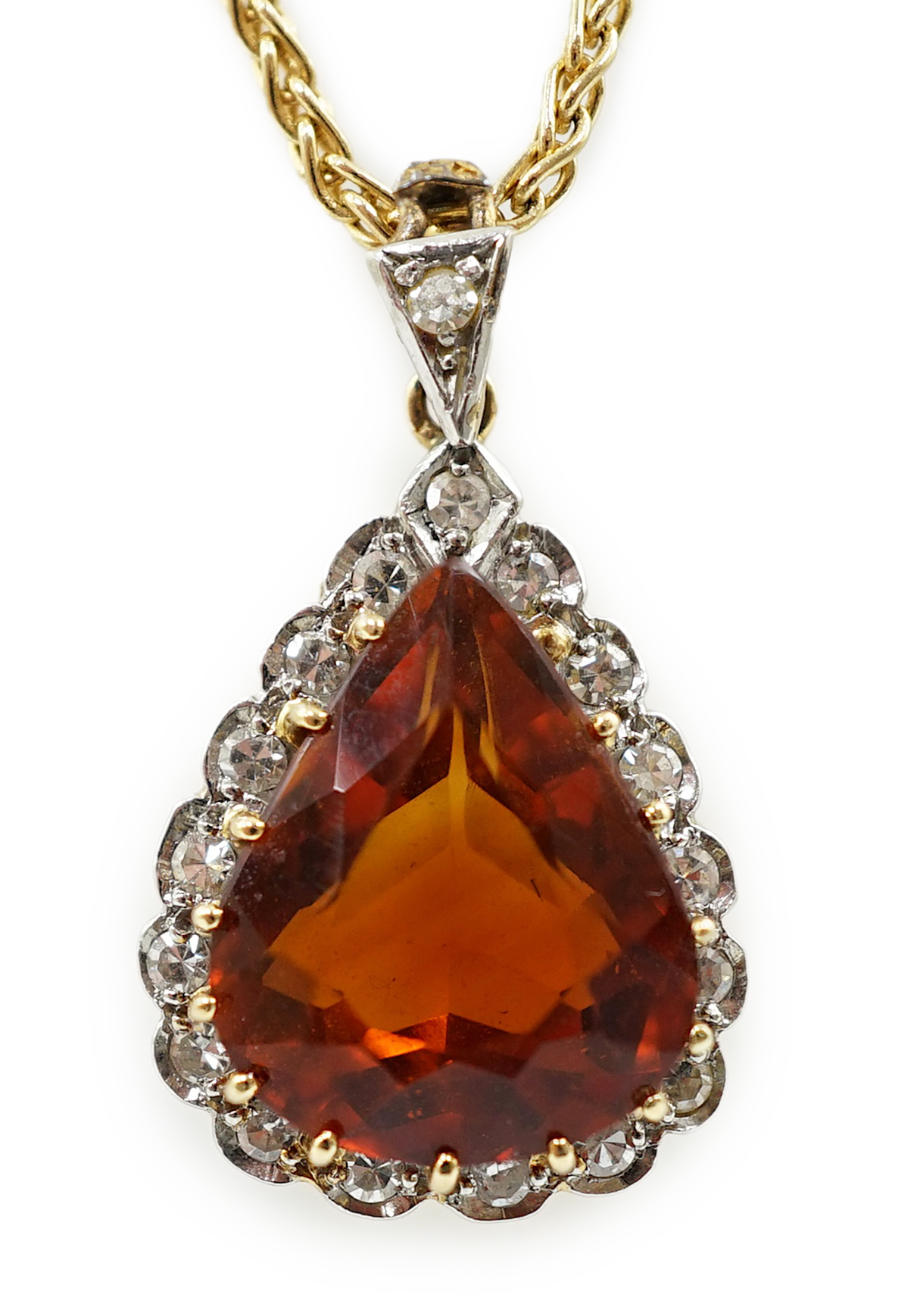 A recent 18k gold, platinum and single stone pear cut citrine pendant, with diamond chip border, on an 18ct gold fine link chain